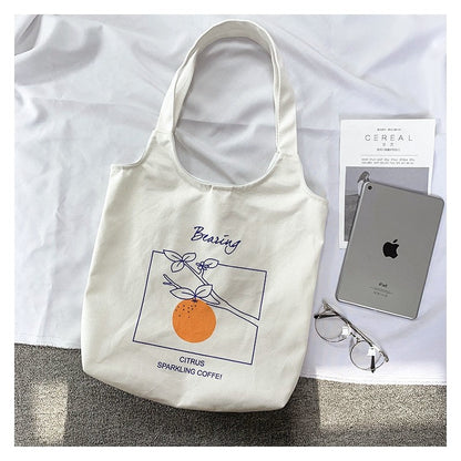 Stylish One-Shoulder Canvas Bag Featuring Vibrant Orange Fruit Print