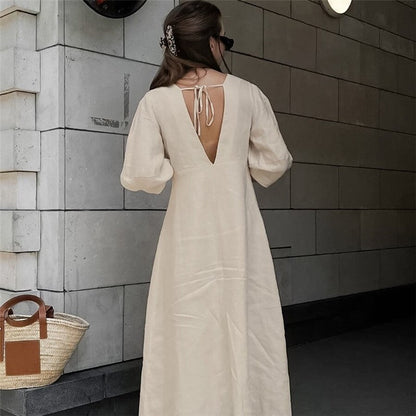 Sure! Here is an optimized title for your clothing product in English:

"Chic V-Neck Dress with Backless