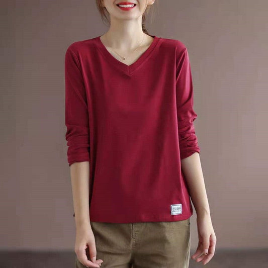 Sure! Here is an optimized title for your clothing product:

"Classic V-Neck Long Sleeve T-Shirt in Solid Color