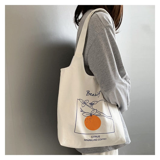 Stylish One-Shoulder Canvas Bag Featuring Vibrant Orange Fruit Print